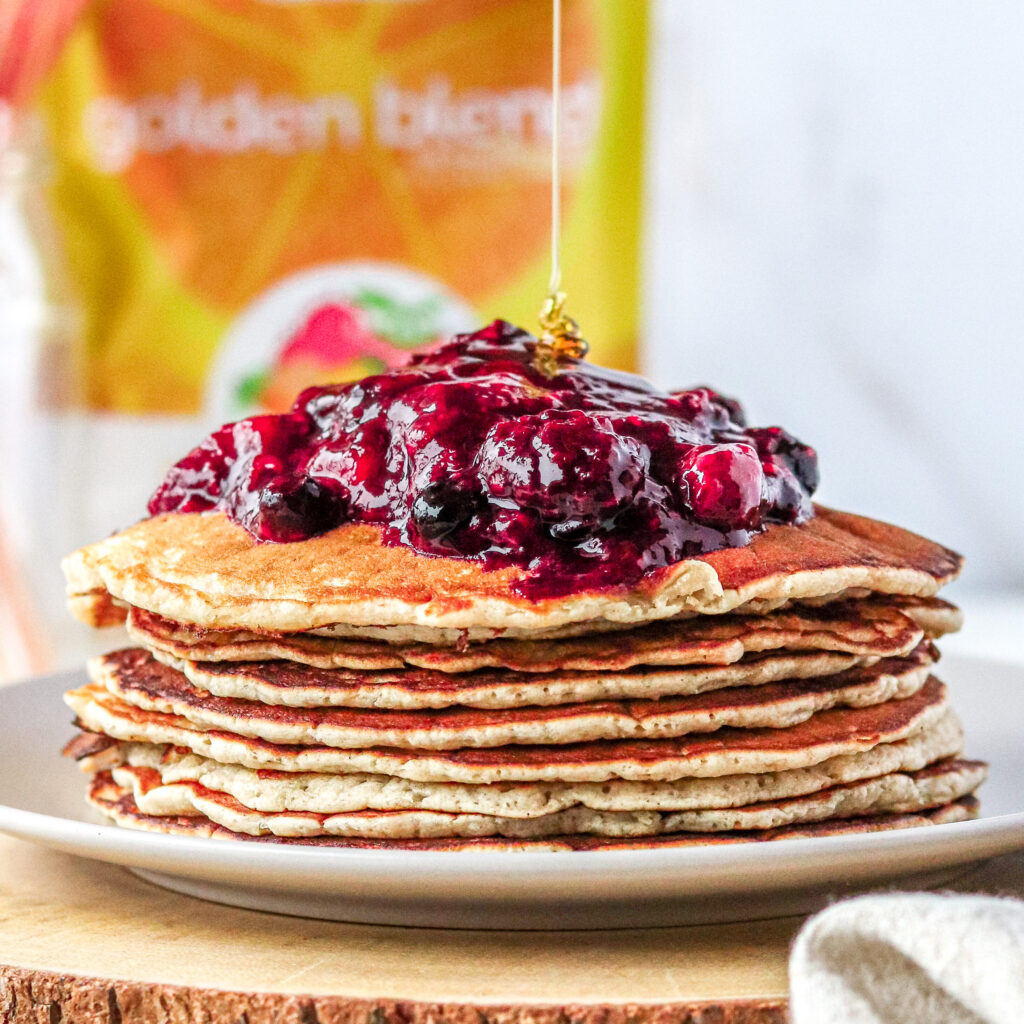 Stack of pancakes with berries on top