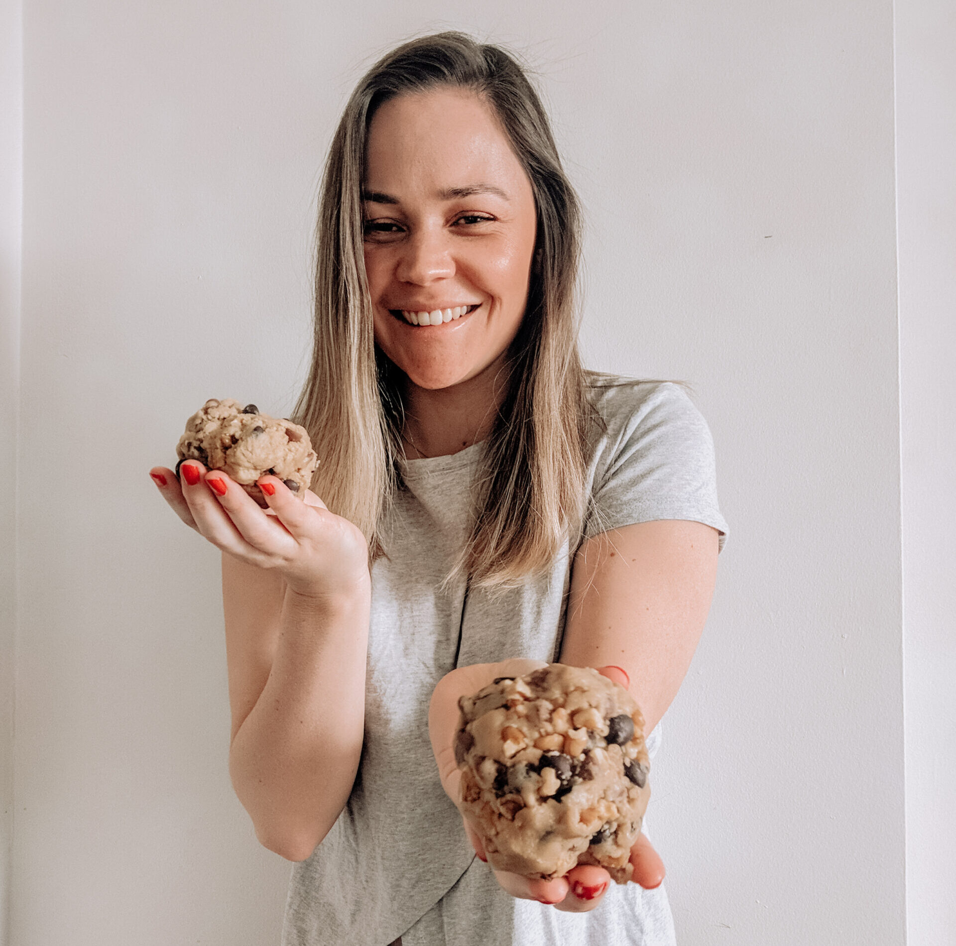 Caitlin Imogen now holding two large cookies