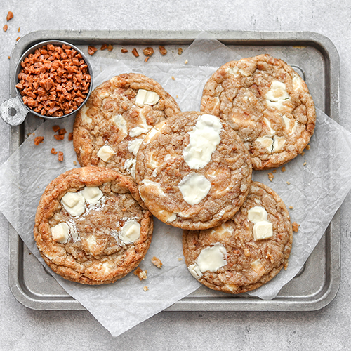 Cookies on parchment paper and on a tray