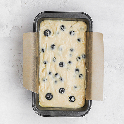 Lemon blueberry loaf cake in pan