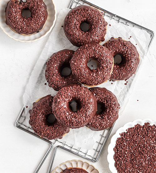 Overhead of baked donuts with chocolate sprinkles