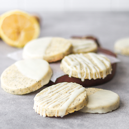 Glazed lemon cookies stacked on each other