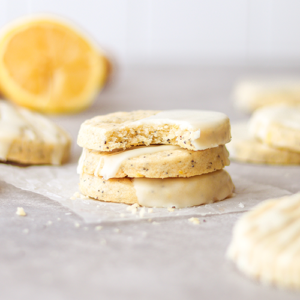 Lemon poppyseed cookies stacked on parchment paper