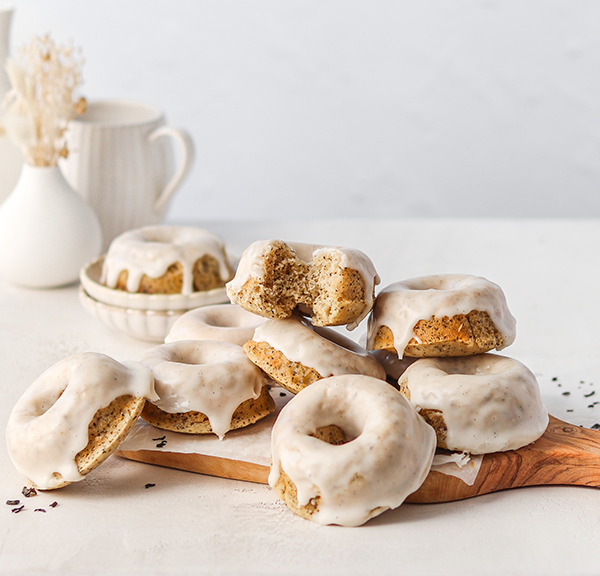 Pile of london fog donuts on a chopping board