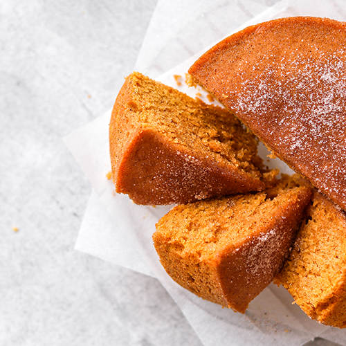 Pumpkin tea cake sliced on parchment paper