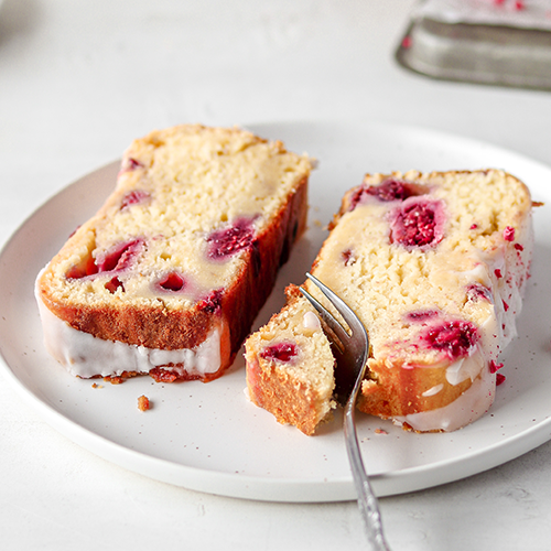 Close up of the texture of a slice of rasperry and lemon loaf cake