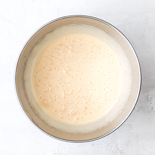 Eggs, vanilla and sugar beaten in a mixing bowl