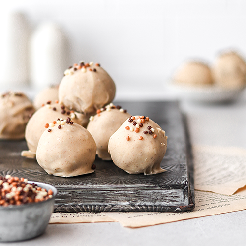 Gingerbread truffles piled on a baking tray