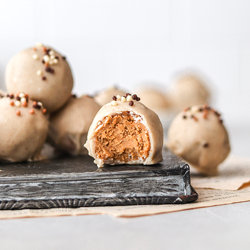 Truffle with a bite taken out of it on a baking tray