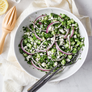 Greek style salad made of parsley, cucumber, feta, and red onion