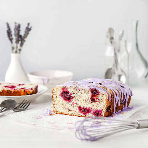 Blackerry pound cake with a whisk in the foreground