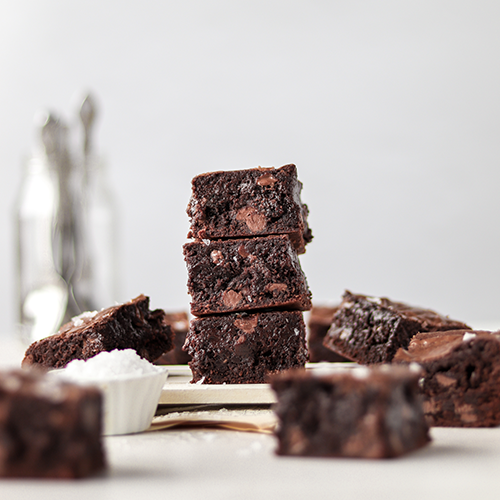 Chocolate brownies stacked on top of each other