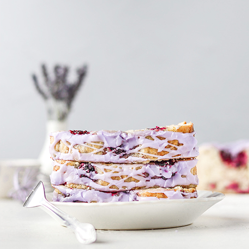 Loaf slices stacked on top of each other, on a small white plate